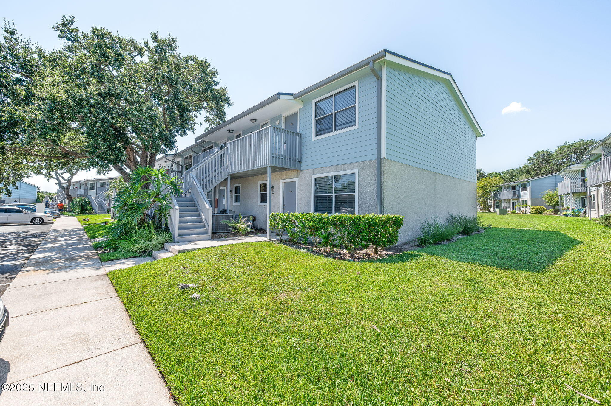 700 West Pope Road, Unit M103 St. Augustine, FL 32080 - Photo 1 of 30 a front view of house with yard