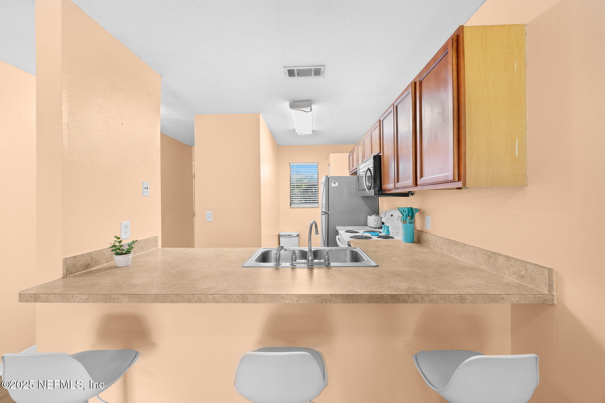 700 West Pope Road, Unit M103 St. Augustine, FL 32080 - Photo 11 of 30 a bathroom with a sink and a mirror