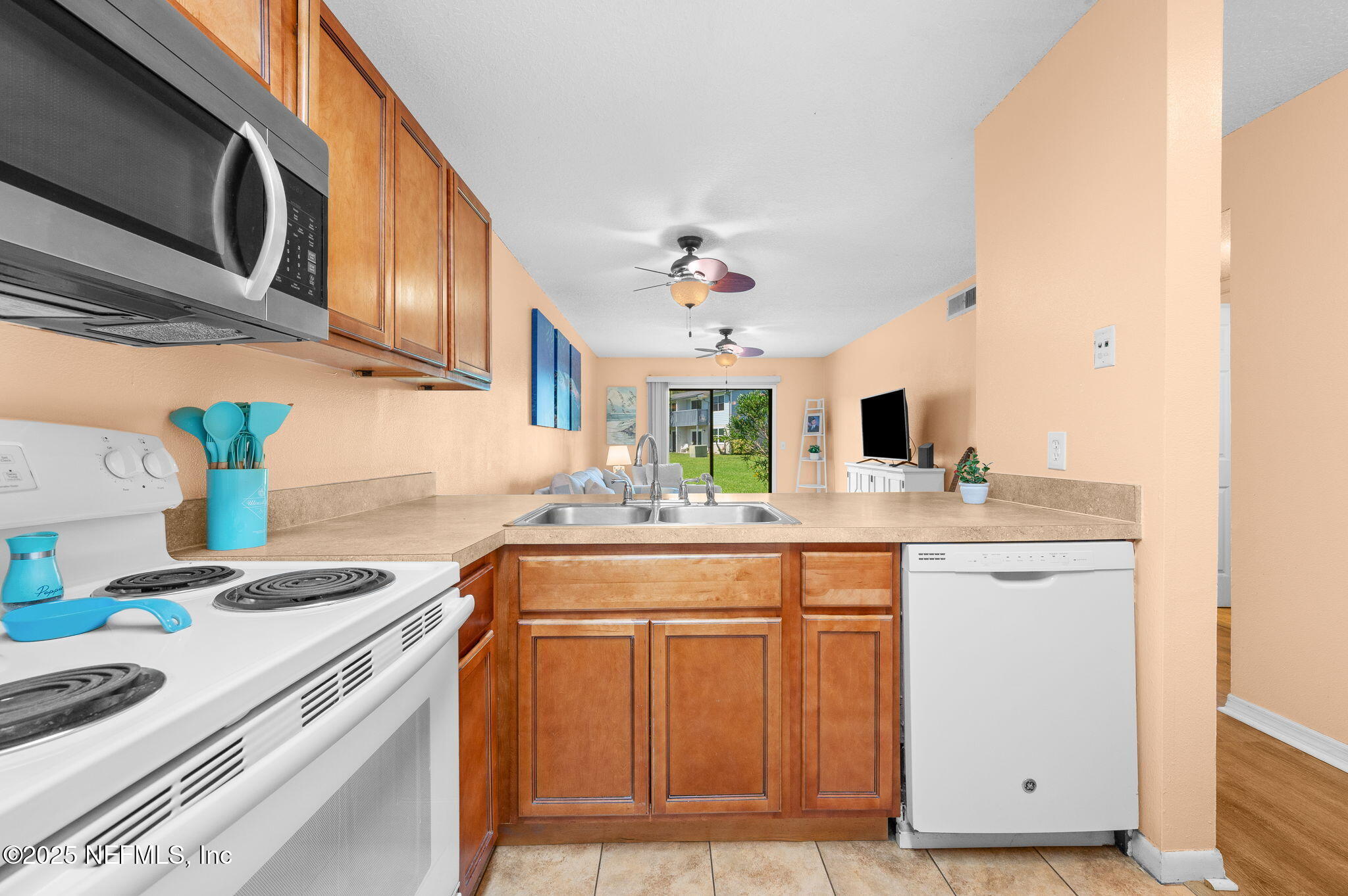 700 West Pope Road, Unit M103 St. Augustine, FL 32080 - Photo 13 of 30 a kitchen with a sink stove and cabinets