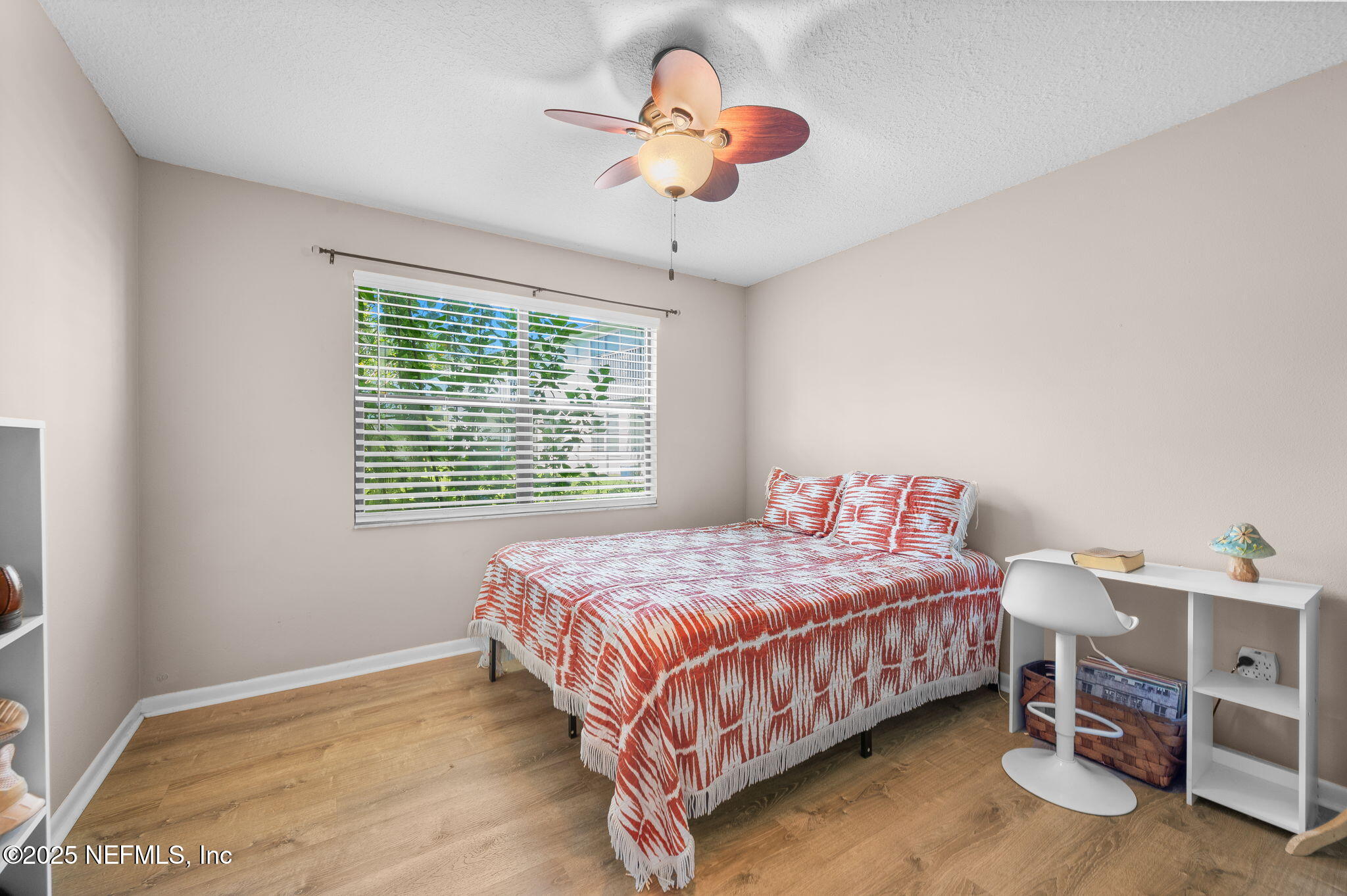 700 West Pope Road, Unit M103 St. Augustine, FL 32080 - Photo 17 of 30 a bedroom with a bed and a chandelier