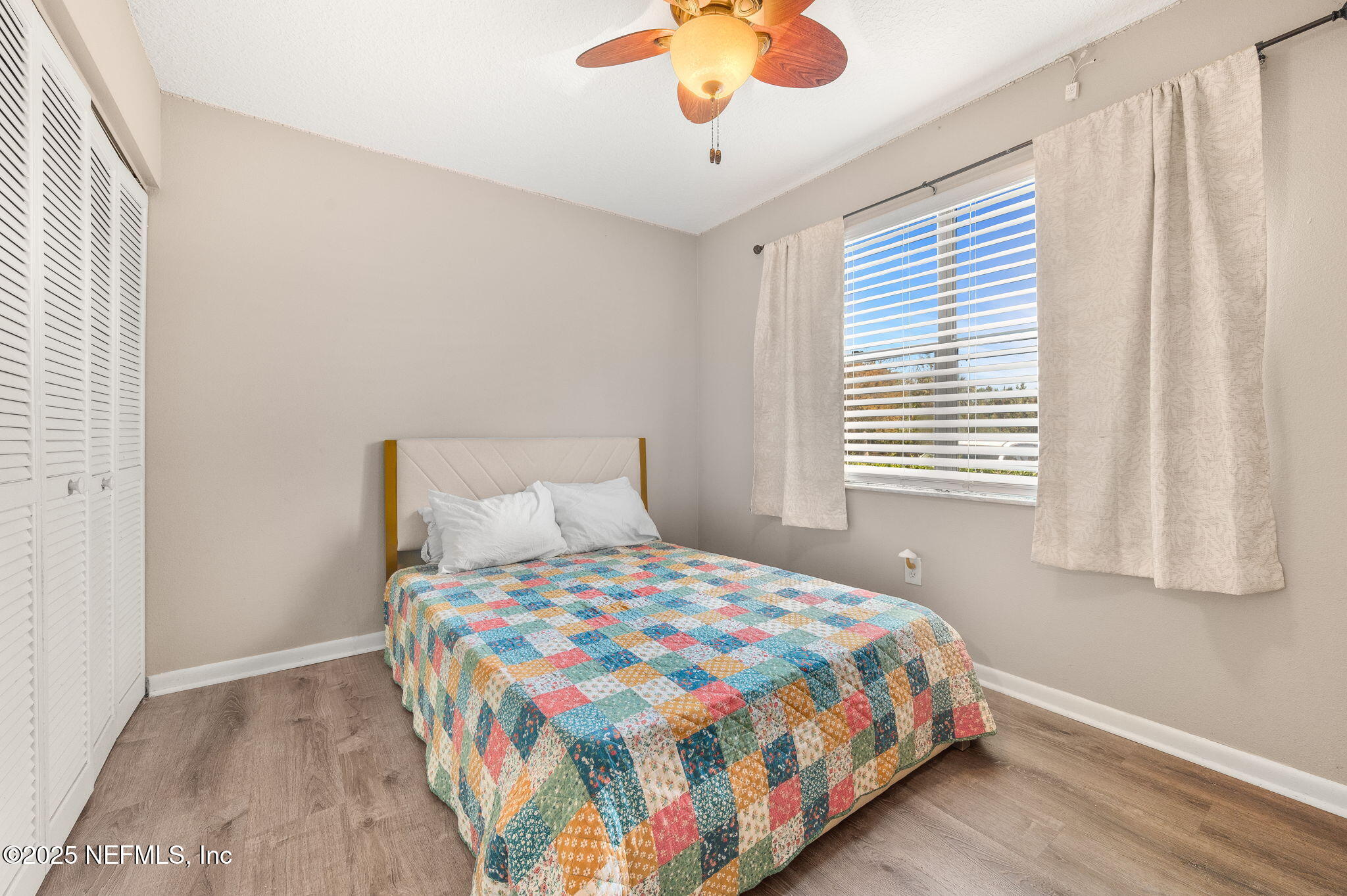 700 West Pope Road, Unit M103 St. Augustine, FL 32080 - Photo 19 of 30 a bedroom with a bed and a window