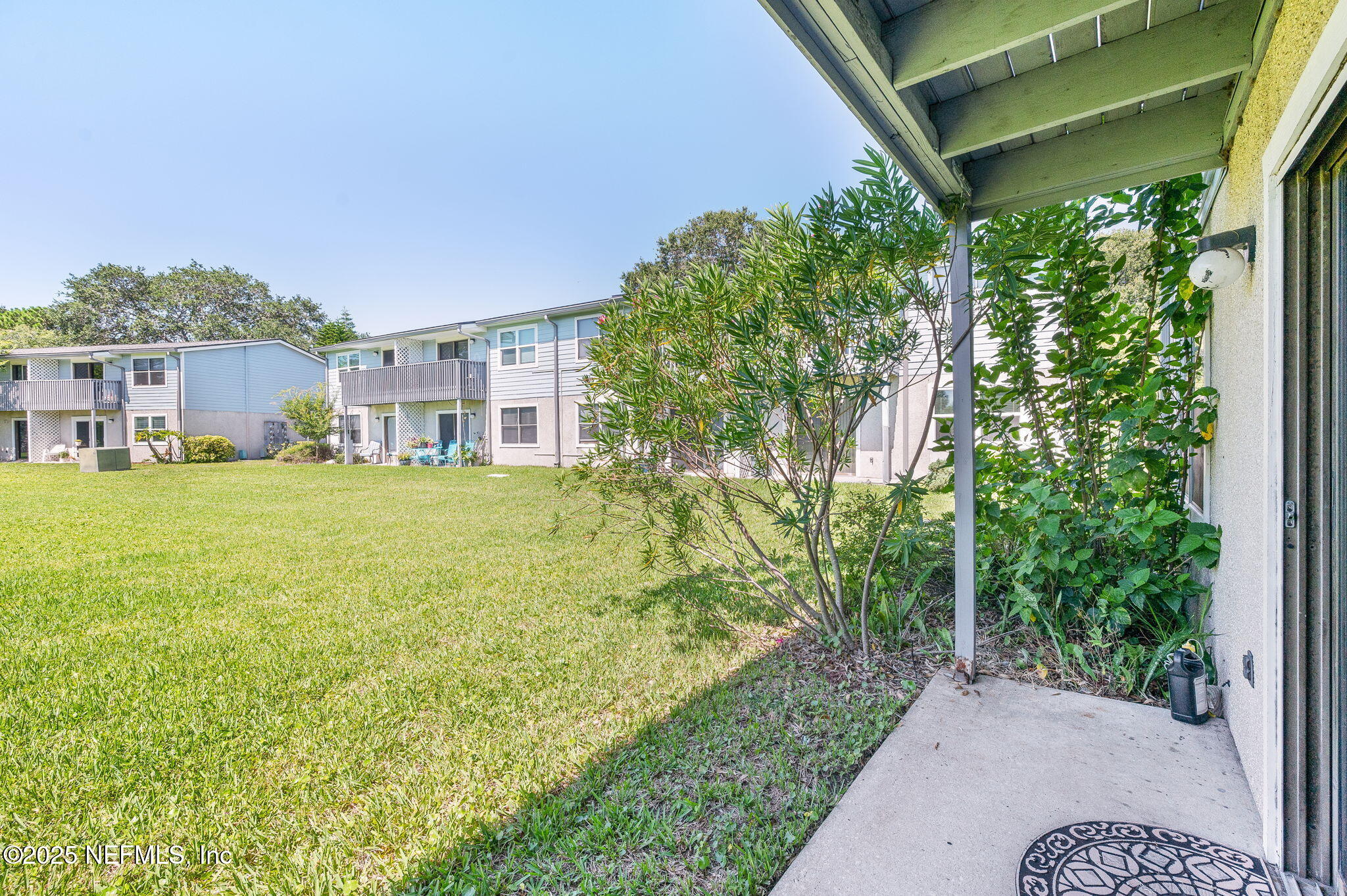 700 West Pope Road, Unit M103 St. Augustine, FL 32080 - Photo 22 of 30 a view of a house with a yard