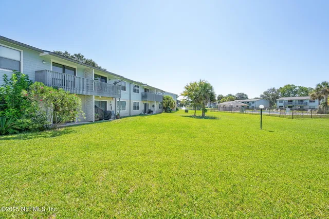 a view of a house with a big yard