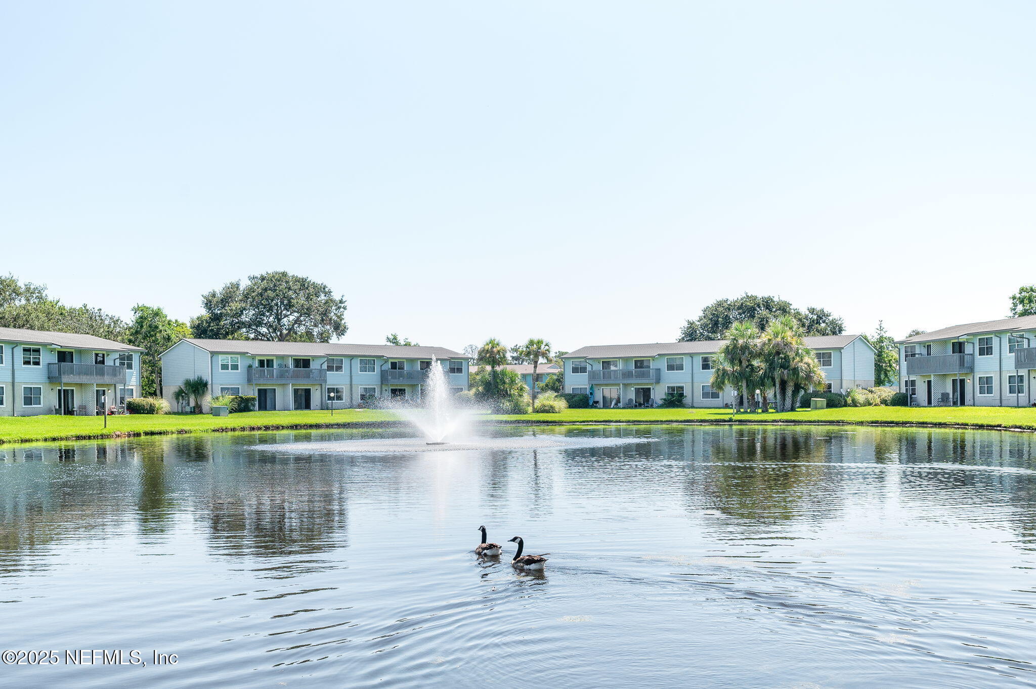 700 West Pope Road, Unit M103 St. Augustine, FL 32080 - Photo 30 of 30 a view of a lake with houses