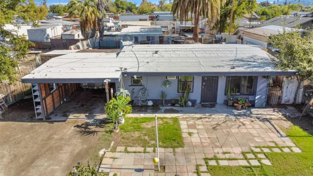 a view of a chairs and table in the patio