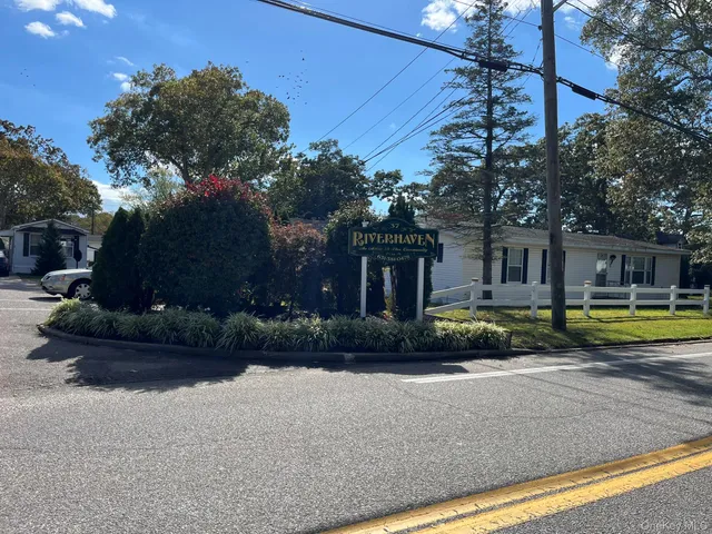 a view of a house with swimming pool and a yard