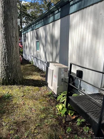 a view of a backyard with wooden fence