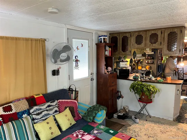 a bedroom with furniture and a wooden floor