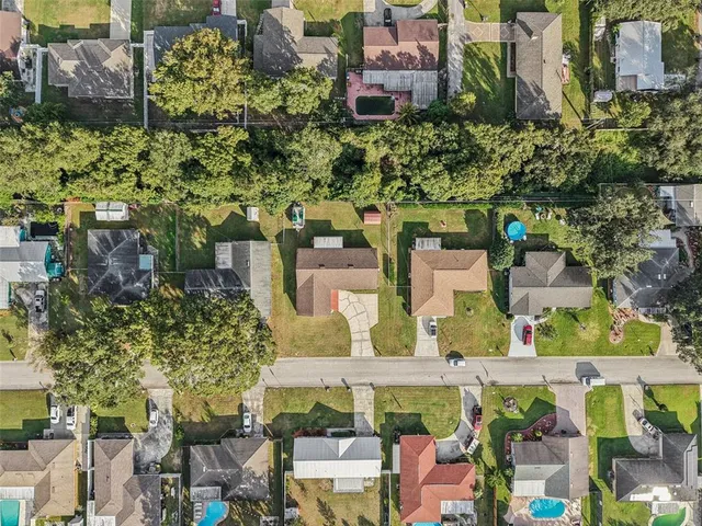 an aerial view of residential houses with outdoor space