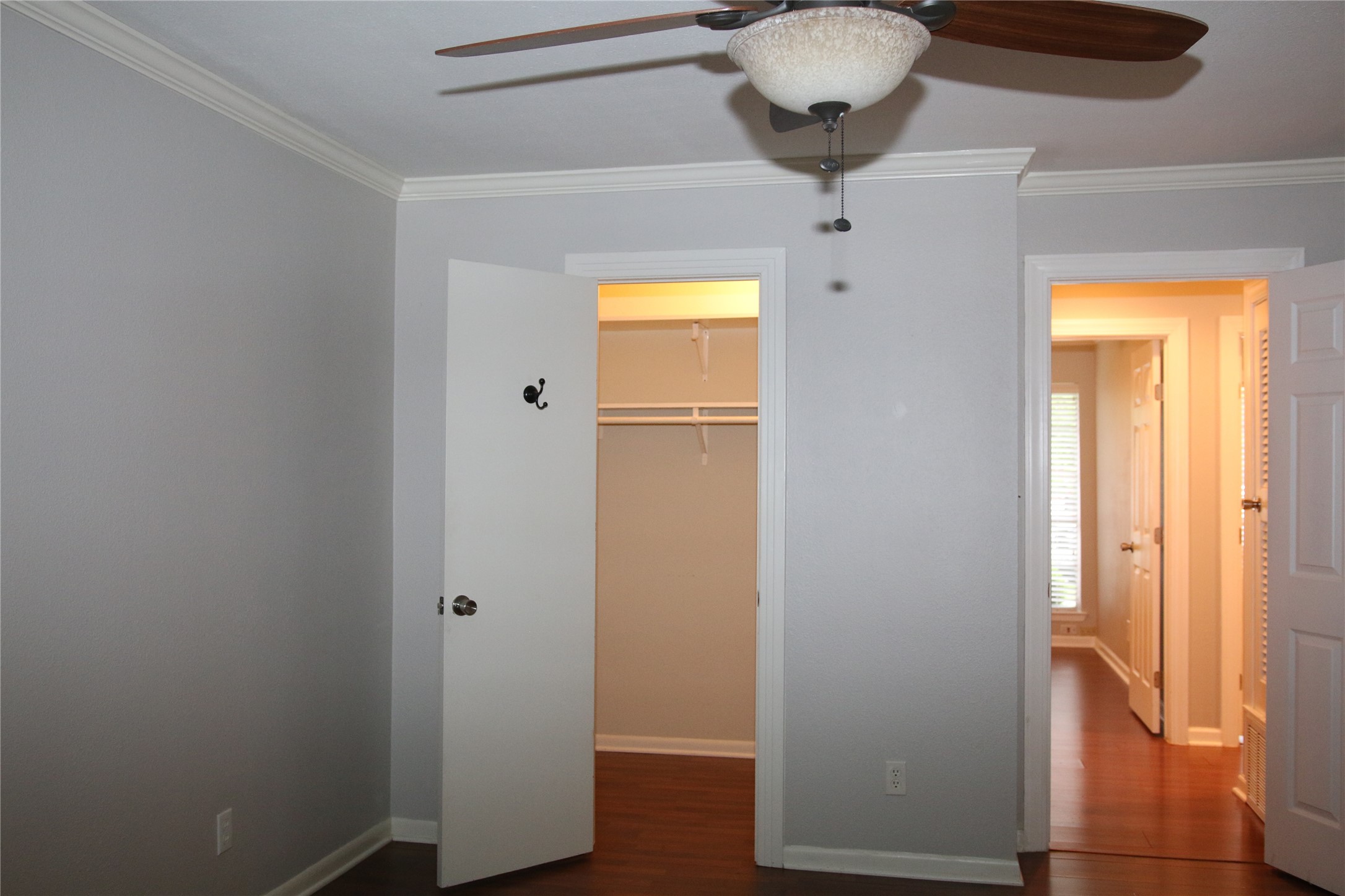 700 Castle Ridge Road, Unit A Austin, TX 78746 - Photo 17 of 34 a view of a hallway with wooden floor