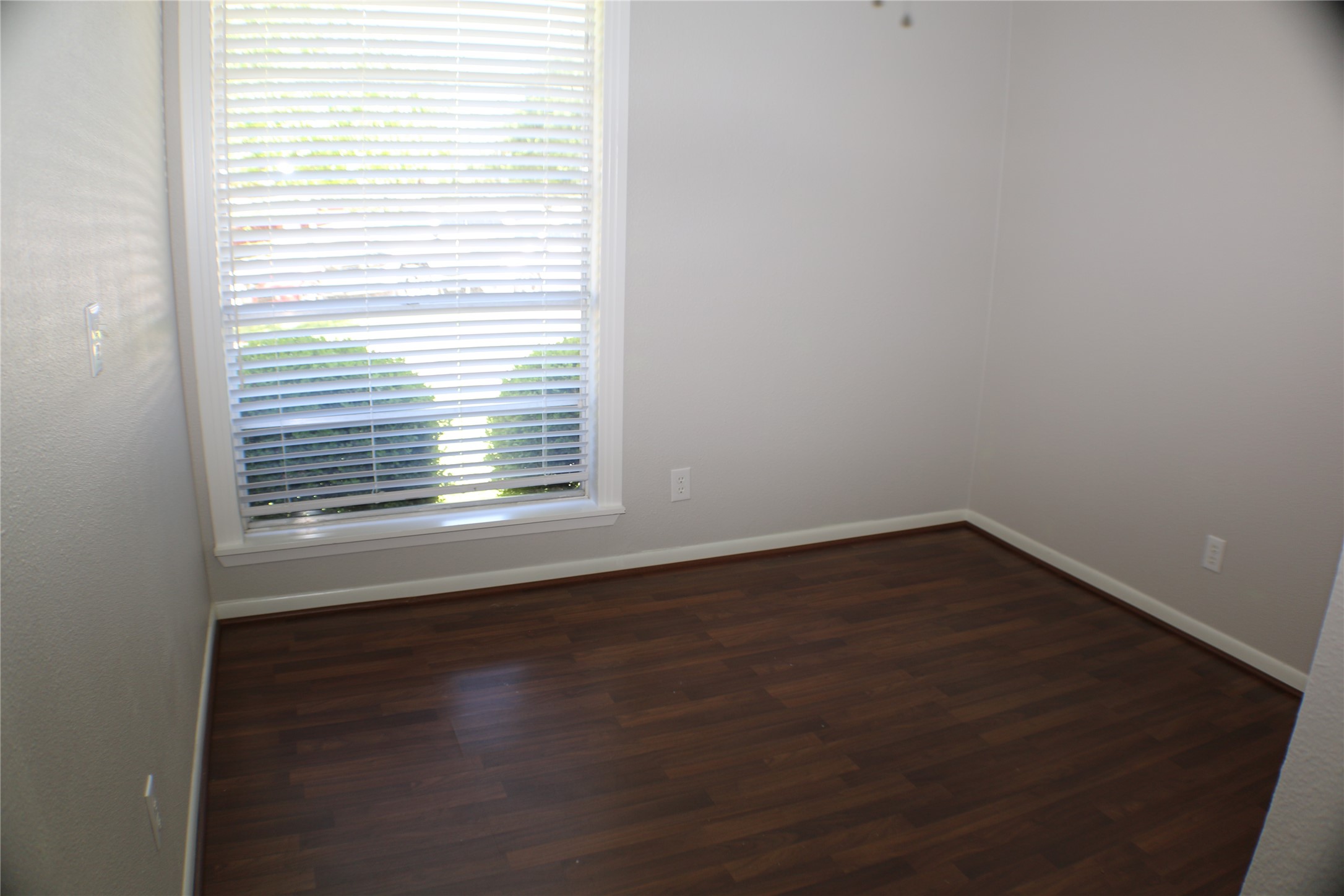 700 Castle Ridge Road, Unit A Austin, TX 78746 - Photo 26 of 34 a view of a small space with wooden floor and a window