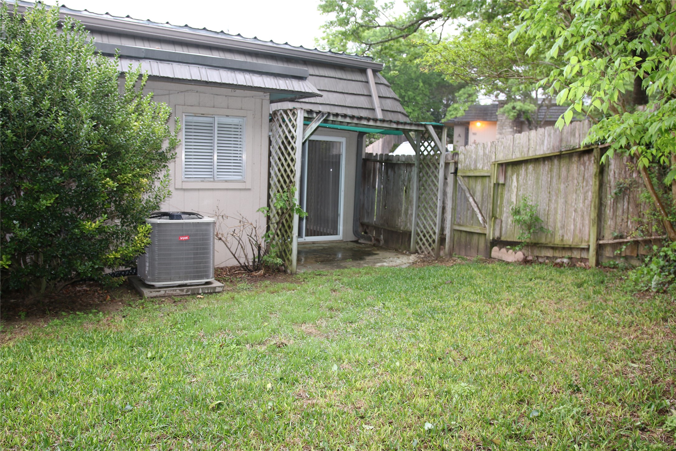 700 Castle Ridge Road, Unit A Austin, TX 78746 - Photo 33 of 34 a view of a house with a yard and tree