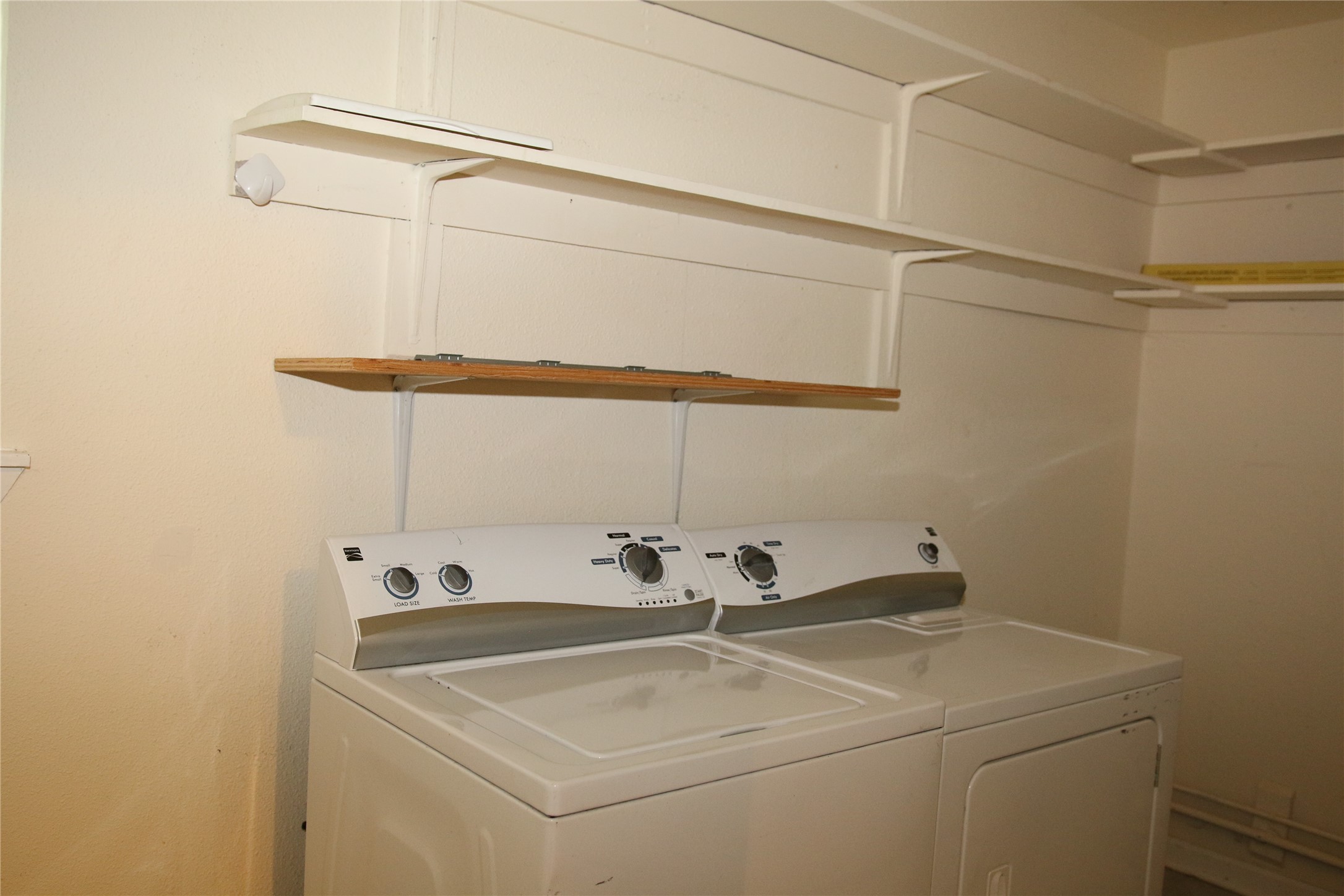 700 Castle Ridge Road, Unit A Austin, TX 78746 - Photo 34 of 34 a utility room with dryer and washer