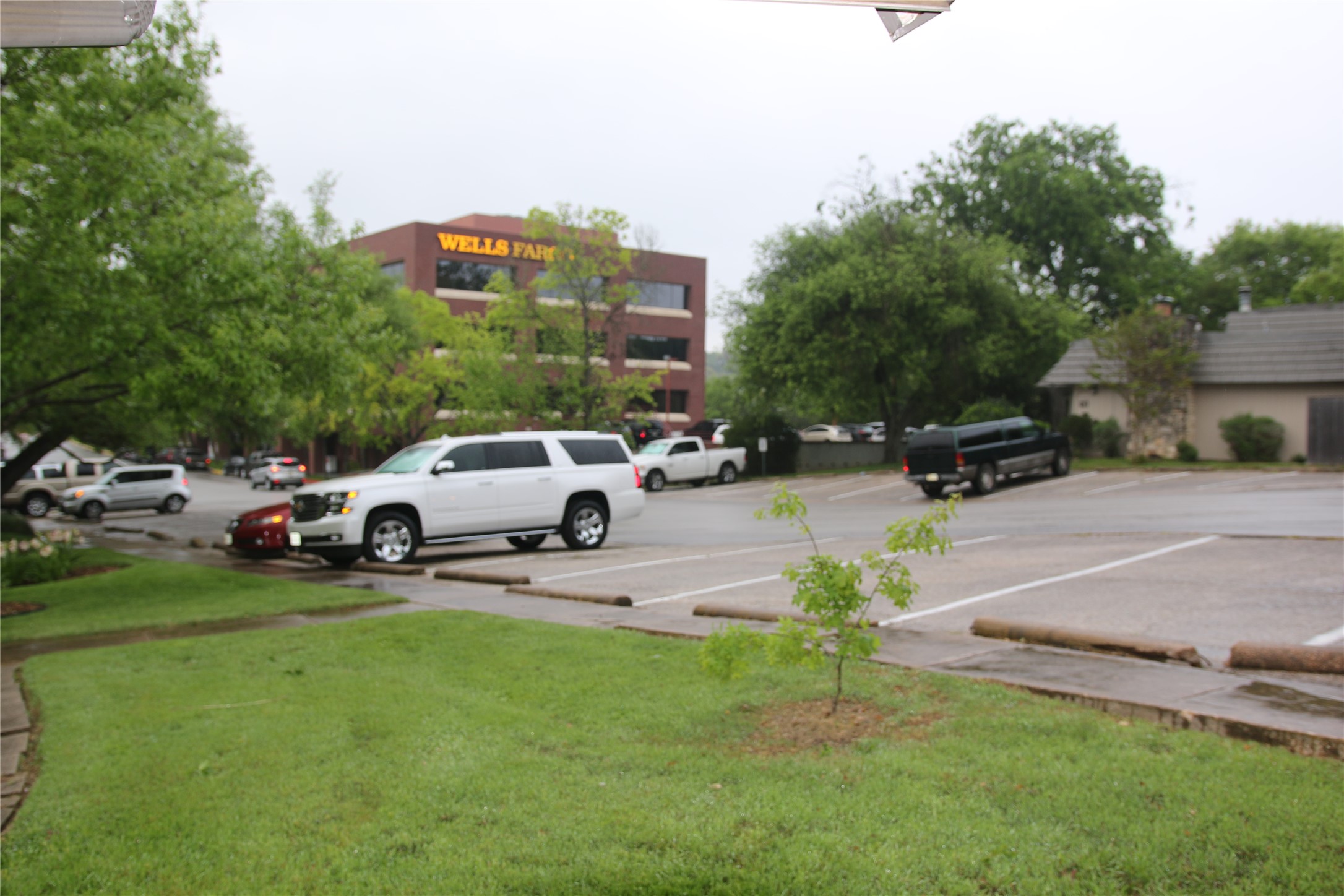 700 Castle Ridge Road, Unit A Austin, TX 78746 - Photo 4 of 34 a view of a parked cars in front of a building