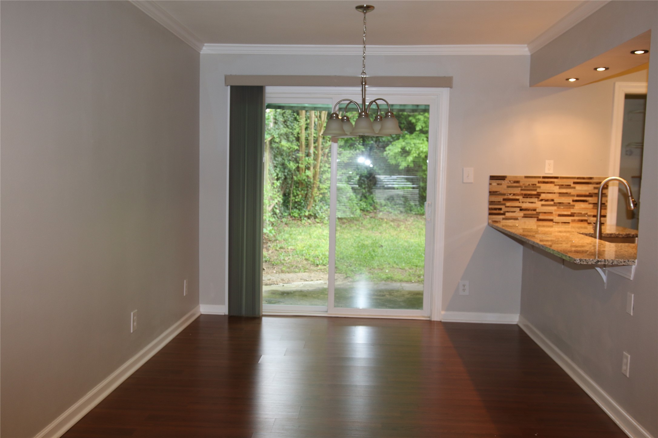 700 Castle Ridge Road, Unit A Austin, TX 78746 - Photo 6 of 34 a view of room with window and wooden floor