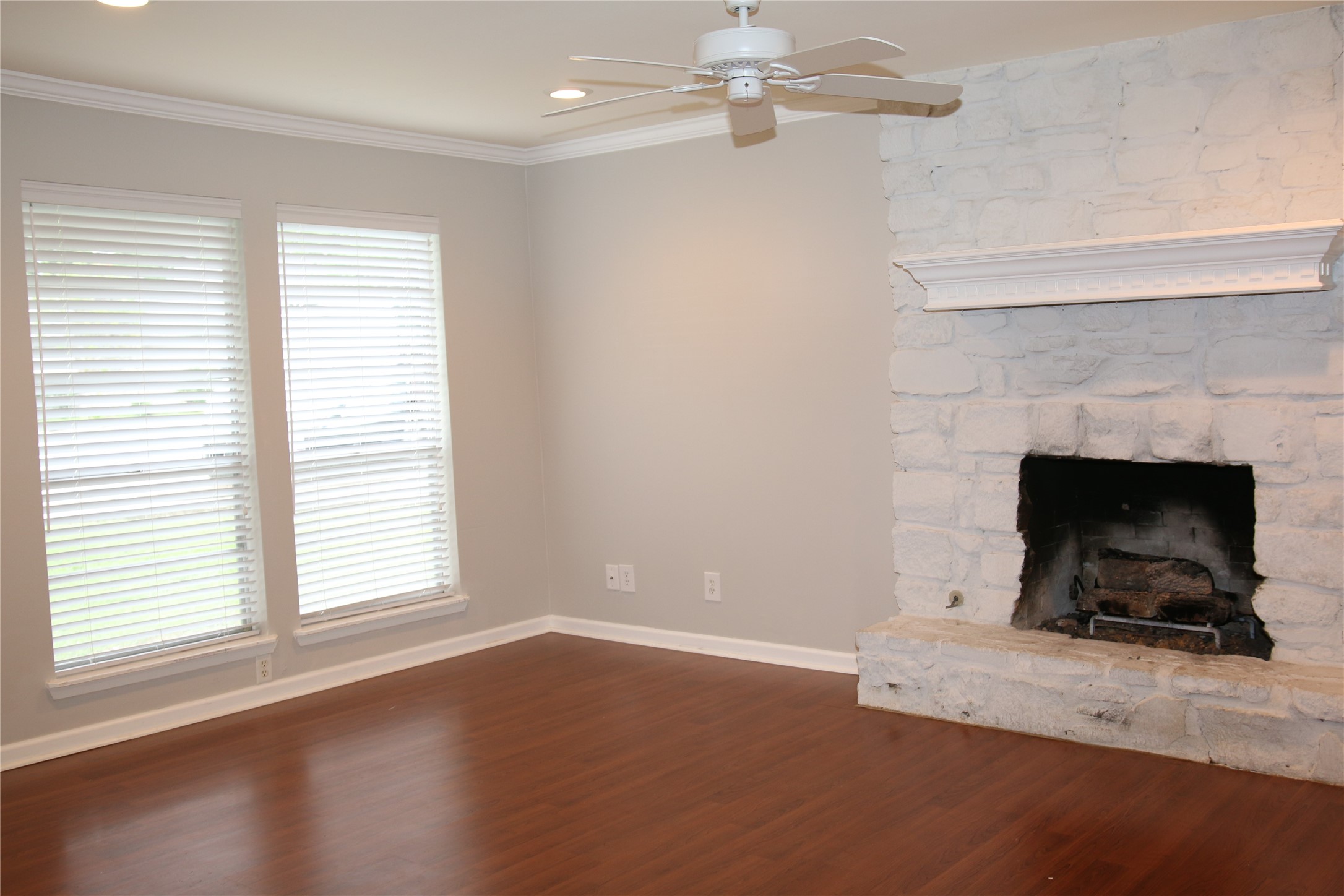 700 Castle Ridge Road, Unit A Austin, TX 78746 - Photo 7 of 34 an empty room with windows and fireplace