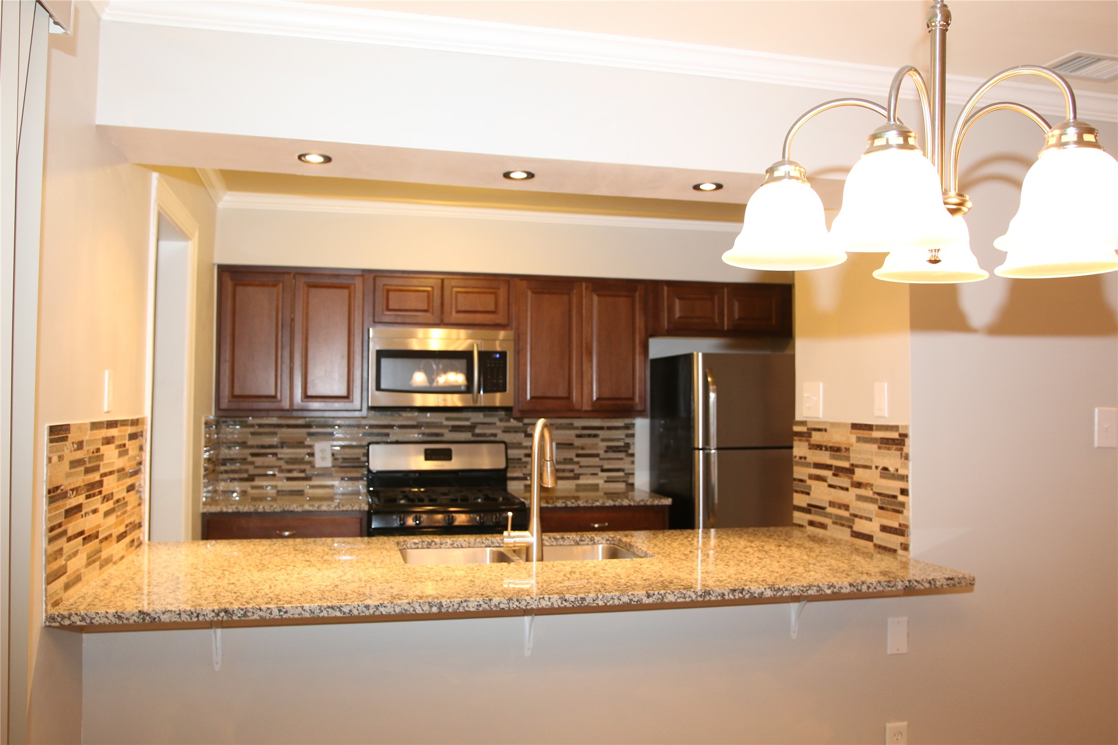 700 Castle Ridge Road, Unit A Austin, TX 78746 - Photo 9 of 34 a bathroom with a sink and a mirror