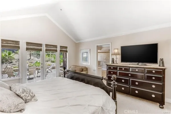 a view of a patio with table and chairs