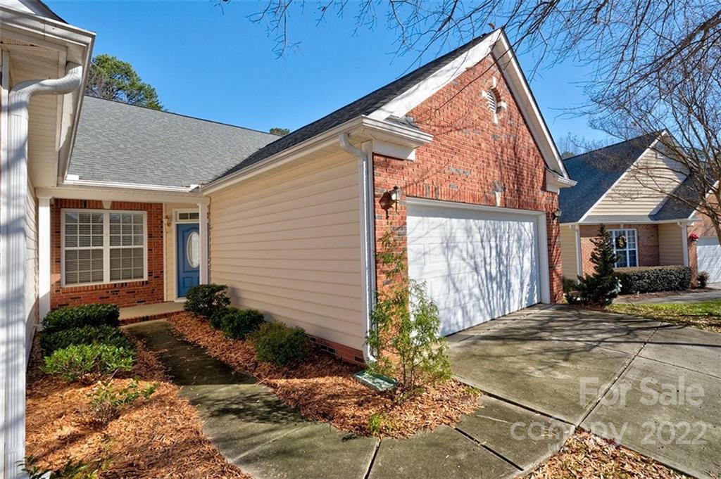 1661 Onyx Ridge Fort Mill, SC 29708 - Photo 3 of 41 a front view of a house with garden