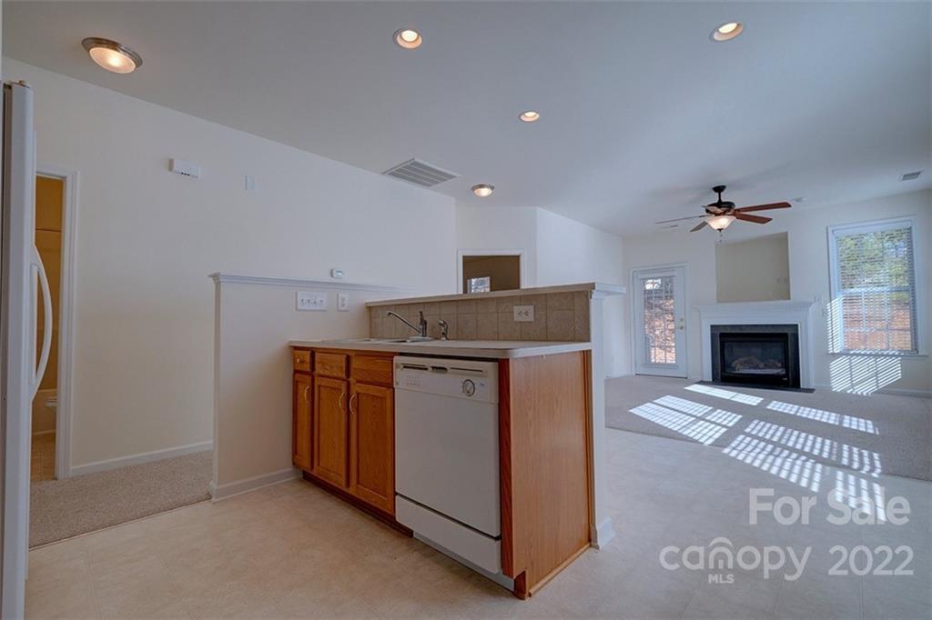 1661 Onyx Ridge Fort Mill, SC 29708 - Photo 8 of 41 a kitchen with a stove and a fireplace