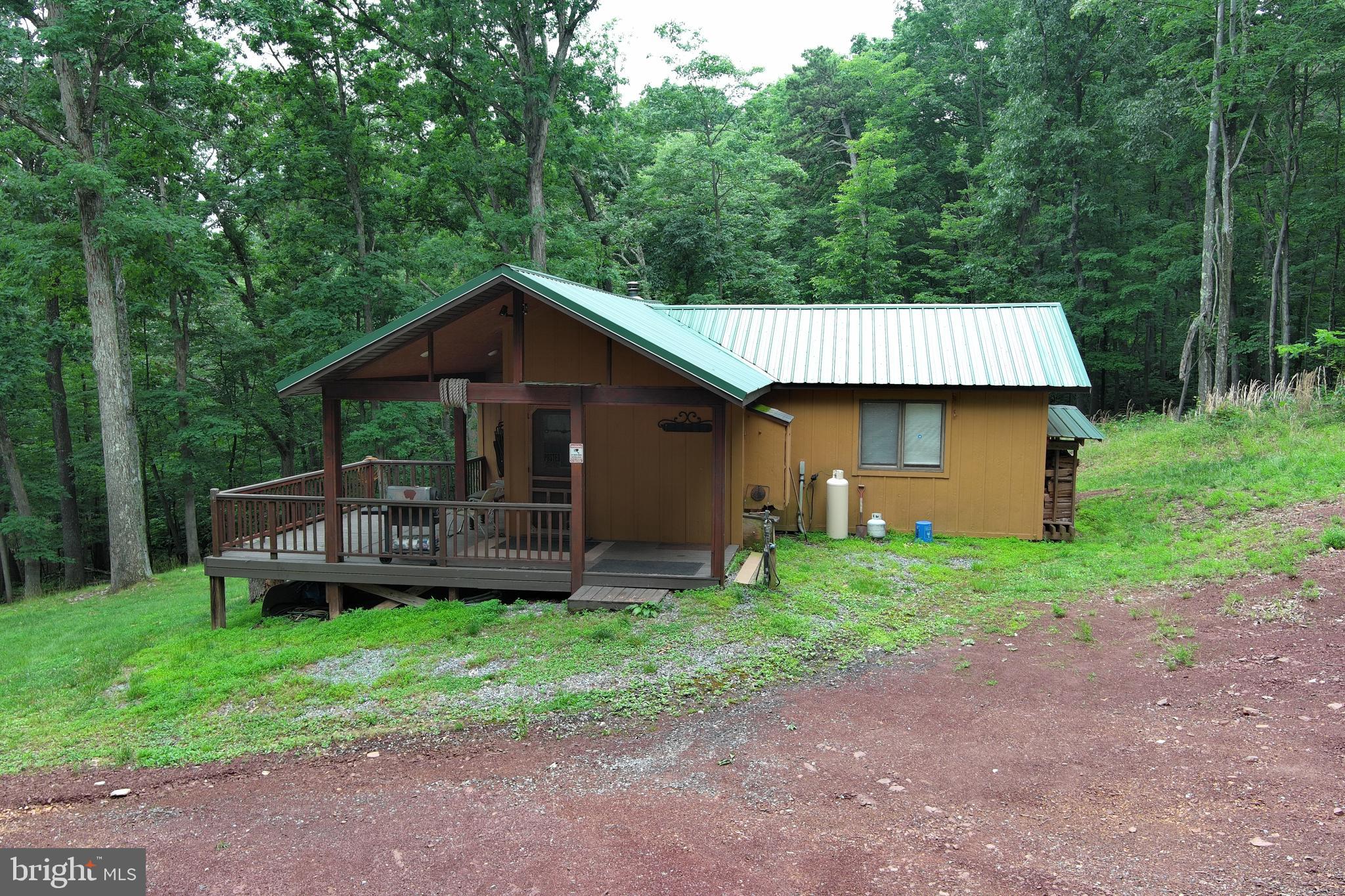 1419 Paul's Woods Road Delray, WV 26714 - Photo 77 of 105 a front view of a house with a yard and fence