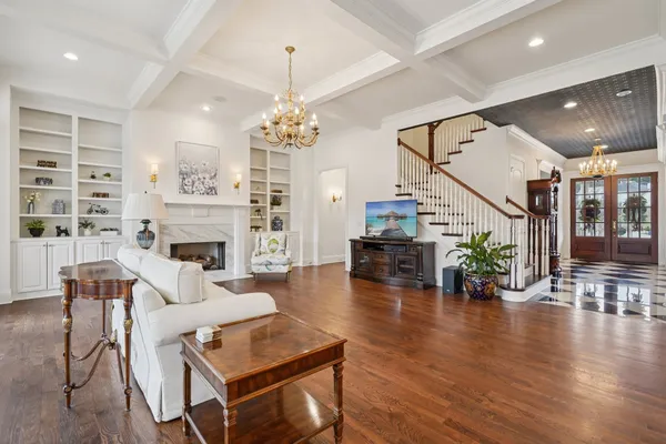 a spacious bedroom with a bed and a fireplace