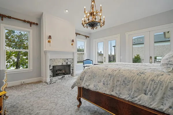 a bedroom with a bed and a mirror
