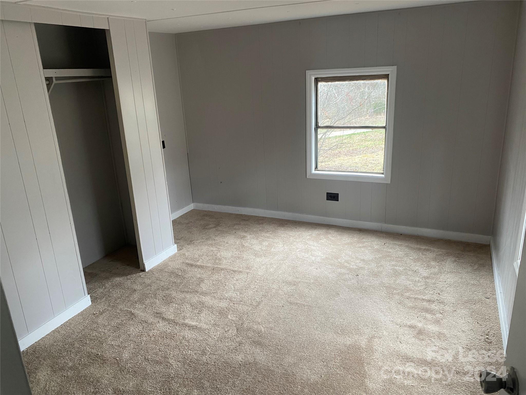 116 Lowman Street, Unit 6 Rutherford College, NC 28690 - Photo 5 of 7 an empty room with windows
