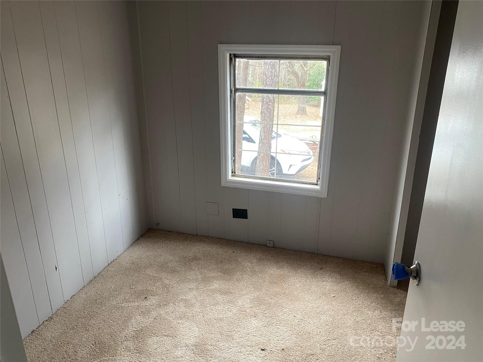 116 Lowman Street, Unit 6 Rutherford College, NC 28690 - Photo 6 of 7 an empty room with windows