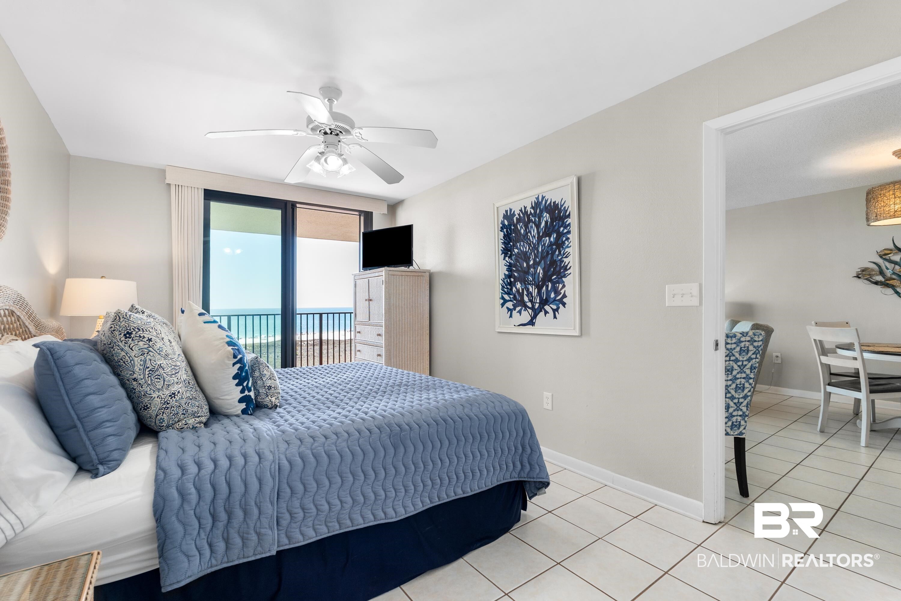 26802 Perdido Beach Boulevard, Unit 406 Orange Beach, AL 36561 - Photo 12 of 37 Bedroom featuring ceiling fan, access to outside, and light tile patterned floors