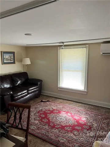 a room with furniture and a rug
