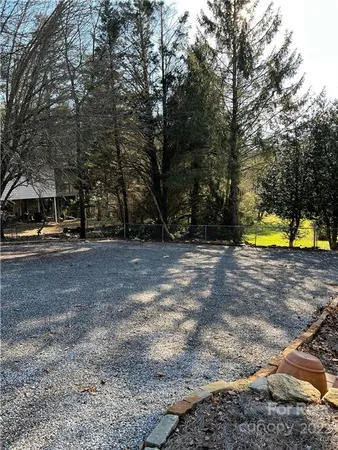 a view of a yard with swimming pool