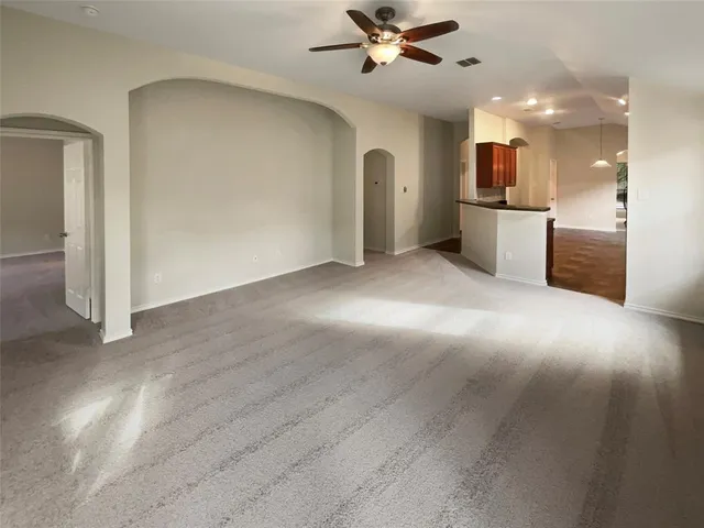 a view of a kitchen with a sink and a window