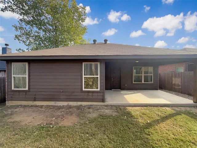 a front view of a house with yard