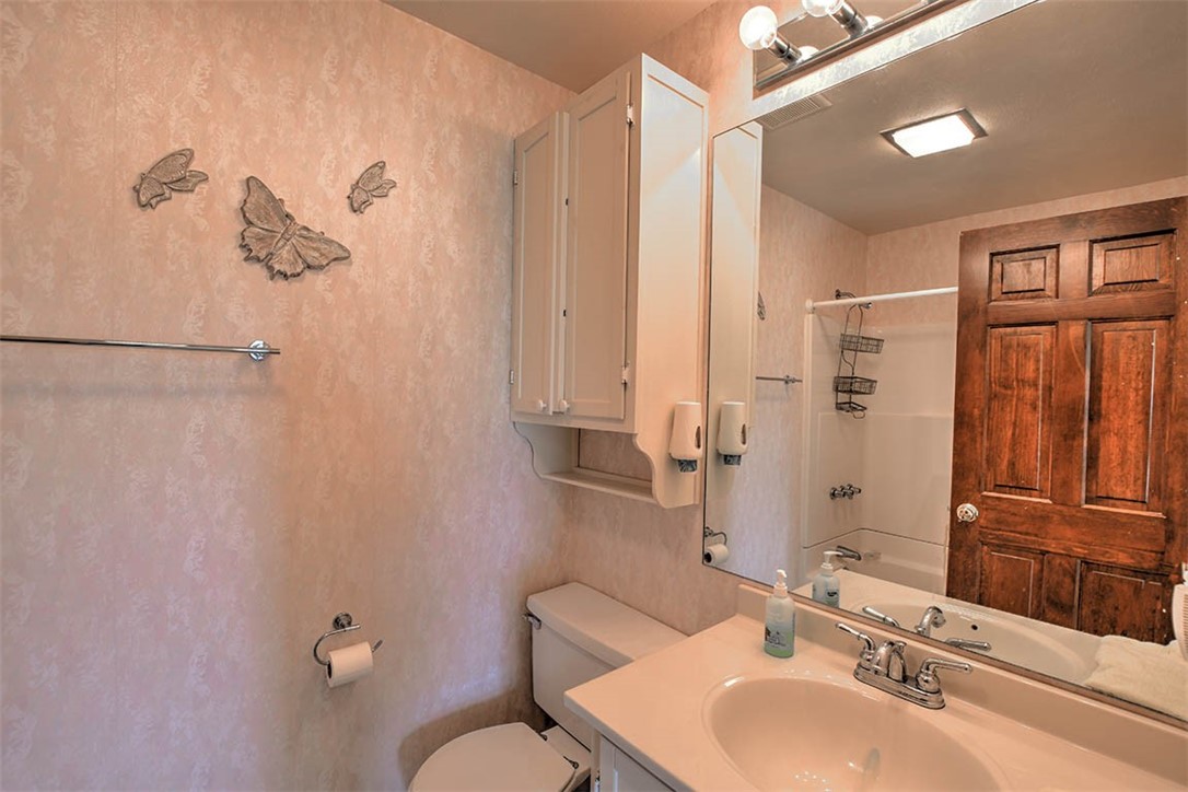 877 East 1800 North Road Assumption, IL 62510 - Photo 41 of 46 a bathroom with a sink toilet and shower