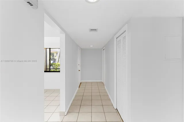 a view of hallway with windows