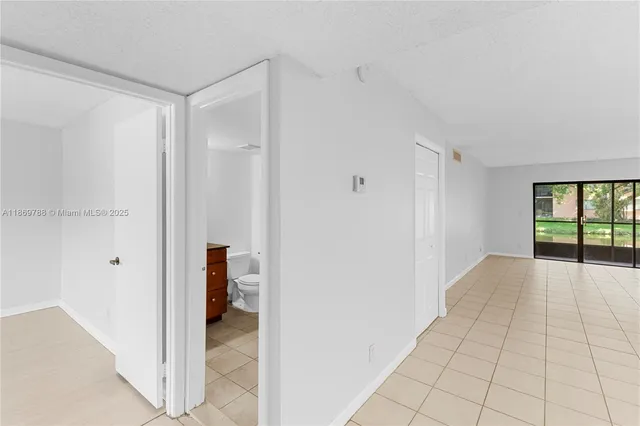 a view of an empty room and window