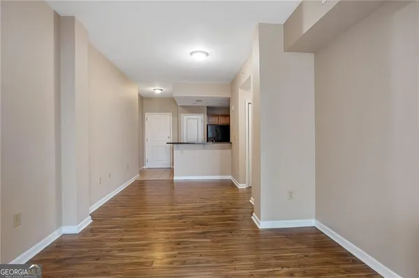 a kitchen that has a sink and a refrigerator