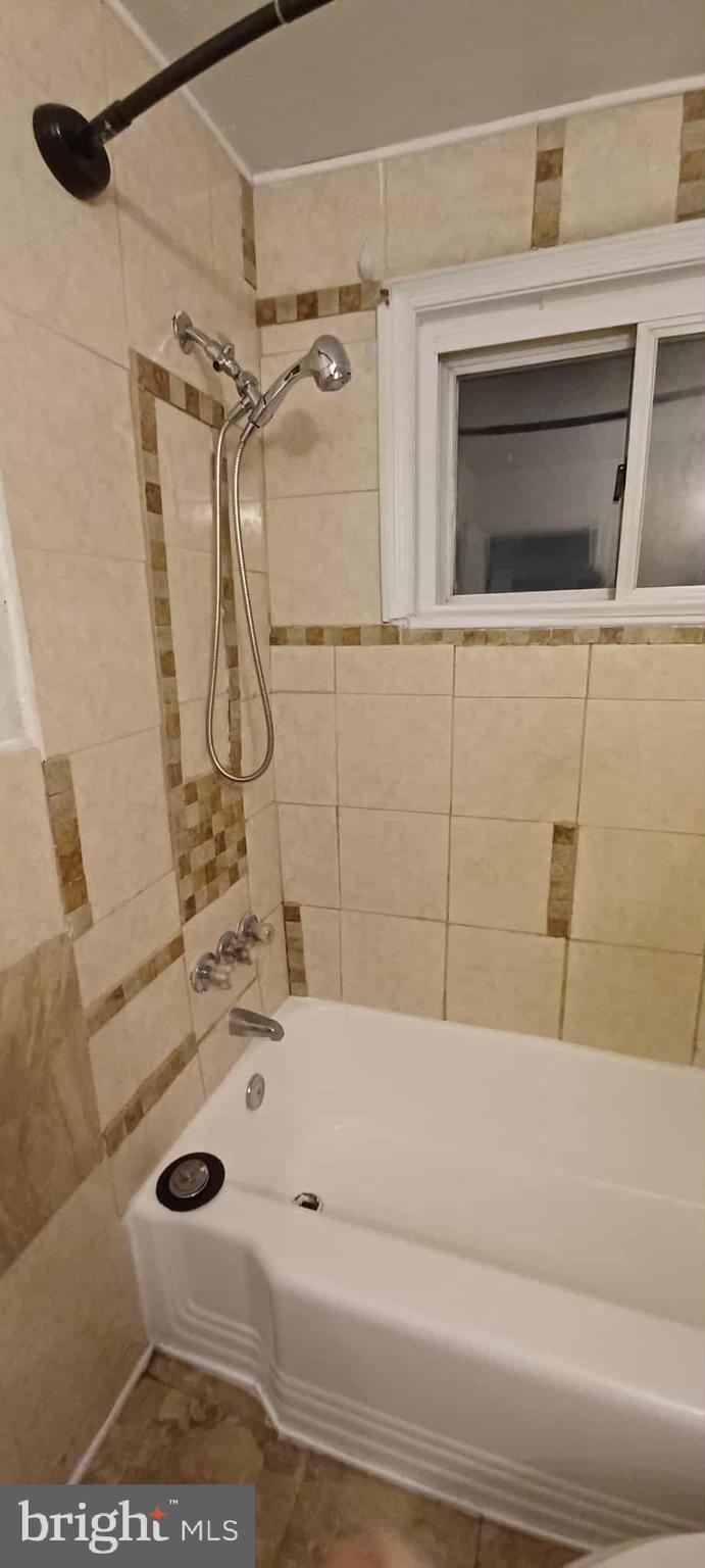 1428 Clairidge Road Baltimore, MD 21207 - Photo 11 of 11 a bathroom with a bathtub and shower