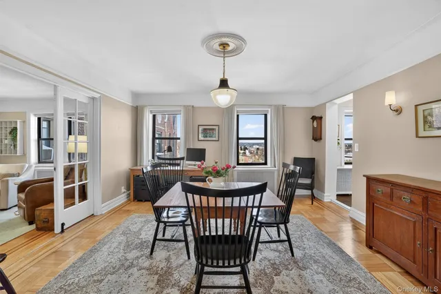 a view of a dining room with furniture window and wooden floor