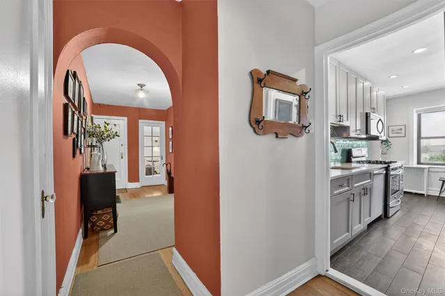 a view of kitchen with stainless steel appliances granite countertop a refrigerator and a sink
