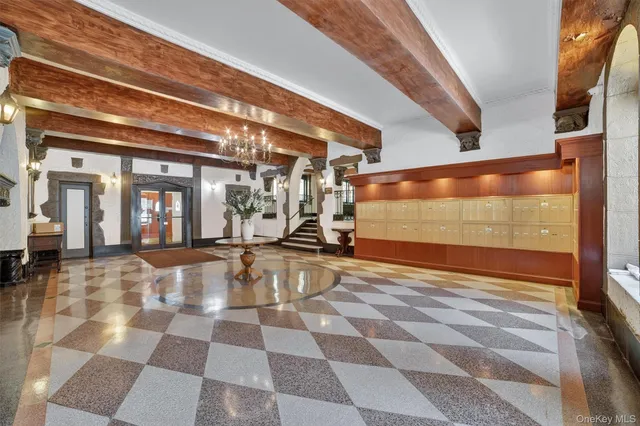 a view of a lobby with a black and white checkered floor