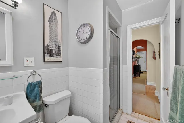 a bathroom with a toilet and a sink