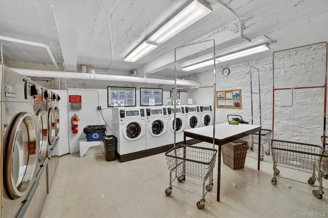 a view of living room and kitchen with furniture wooden floor and windows