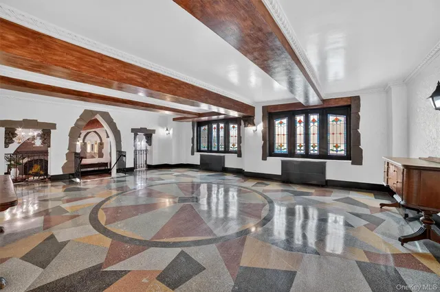 a front view of a building with a garden