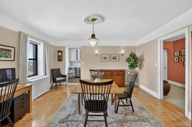 a view of a dining room with furniture window and wooden floor