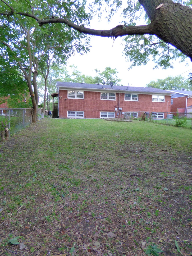 6830 Valley View Road Hanover Park, IL 60133 - Photo 6 of 8 a view of a yard with an outdoor space