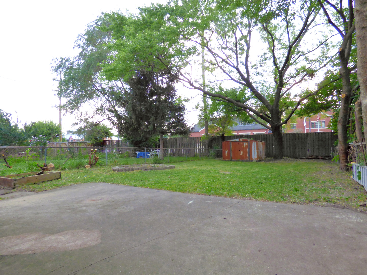6830 Valley View Road Hanover Park, IL 60133 - Photo 7 of 8 a view of a house with backyard and trees