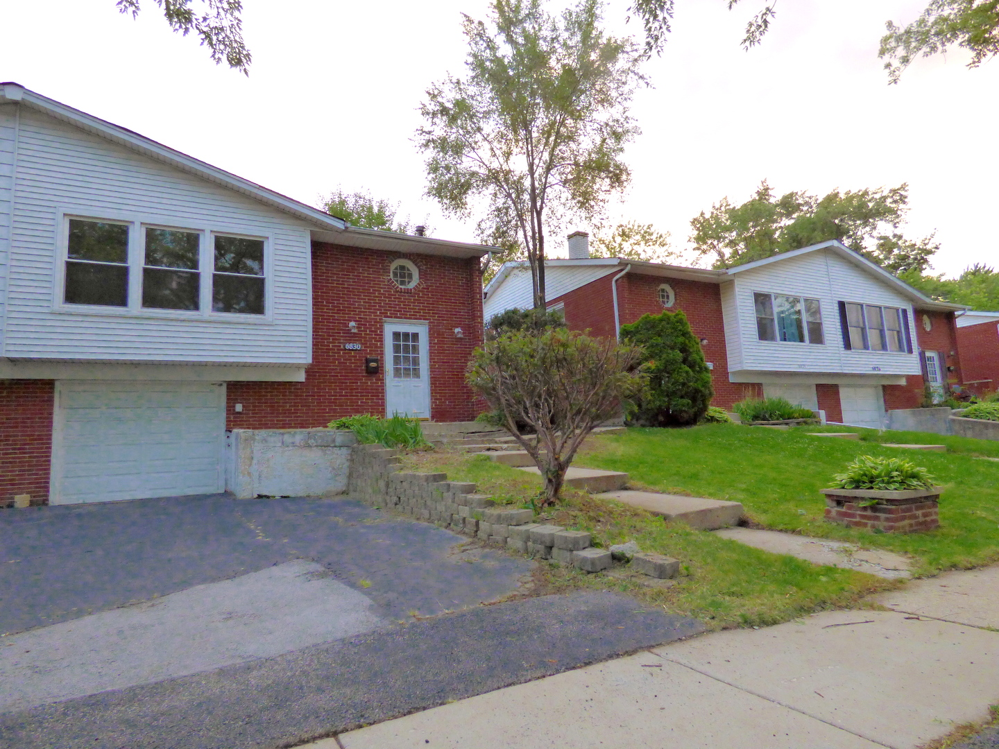 6830 Valley View Road Hanover Park, IL 60133 - Photo 8 of 8 a view of a house with a yard and plants