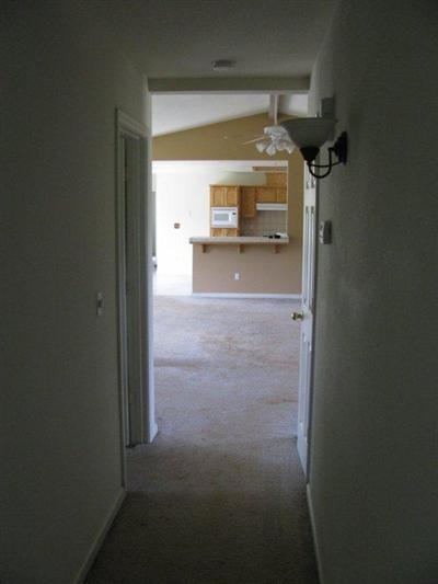 6496 Elwood Road Sanger, CA 93657 - Photo 20 of 26 HALLWAY FROM BEDROOMS TOWARD FAMILYROOM / KITCHEN
